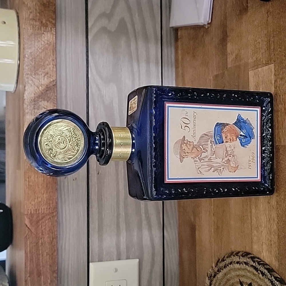 Empty JW Dant Distillers had an American Legion 50th anniversary 1969 square cob